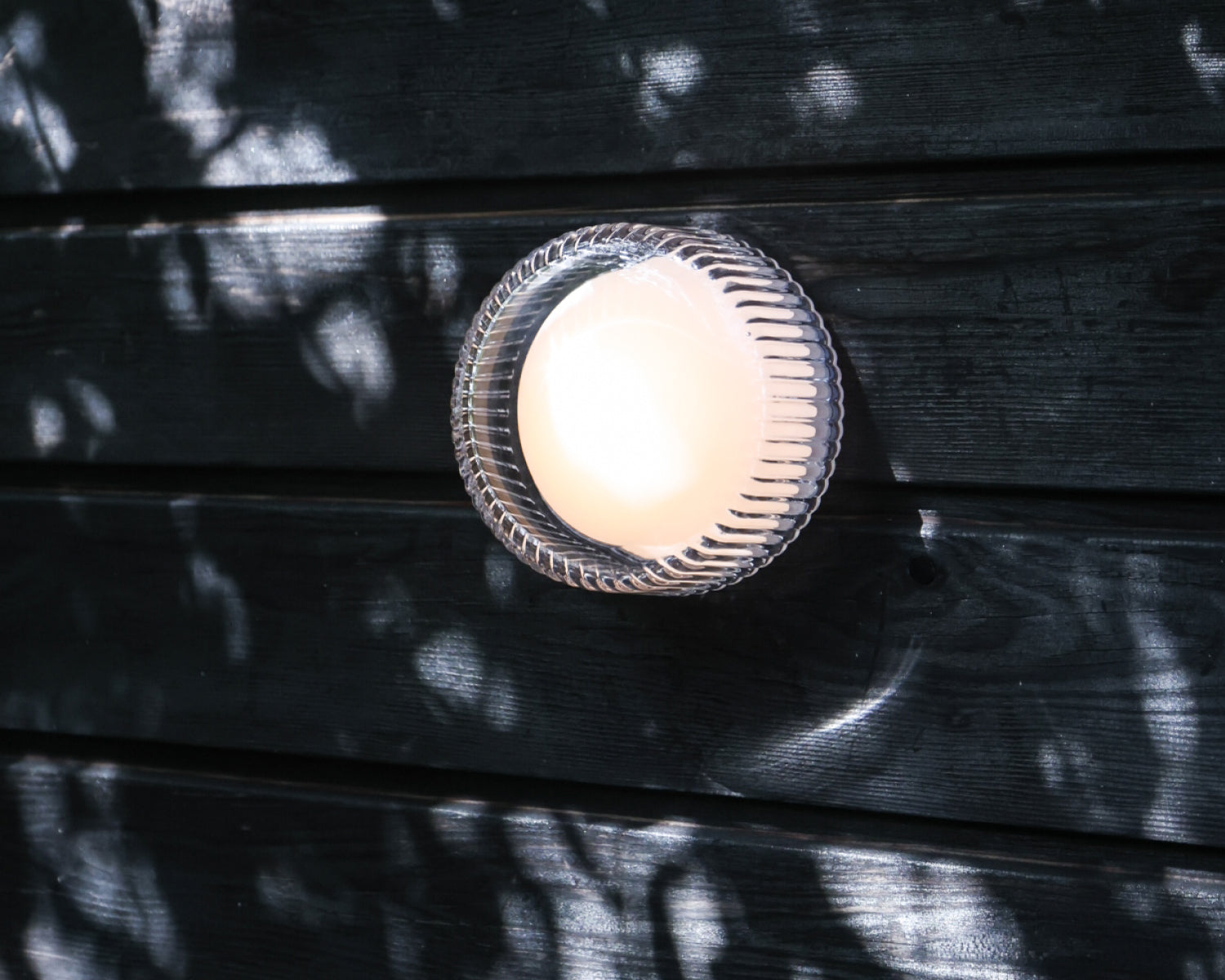 Firth Wall Light outside with shadows across the image