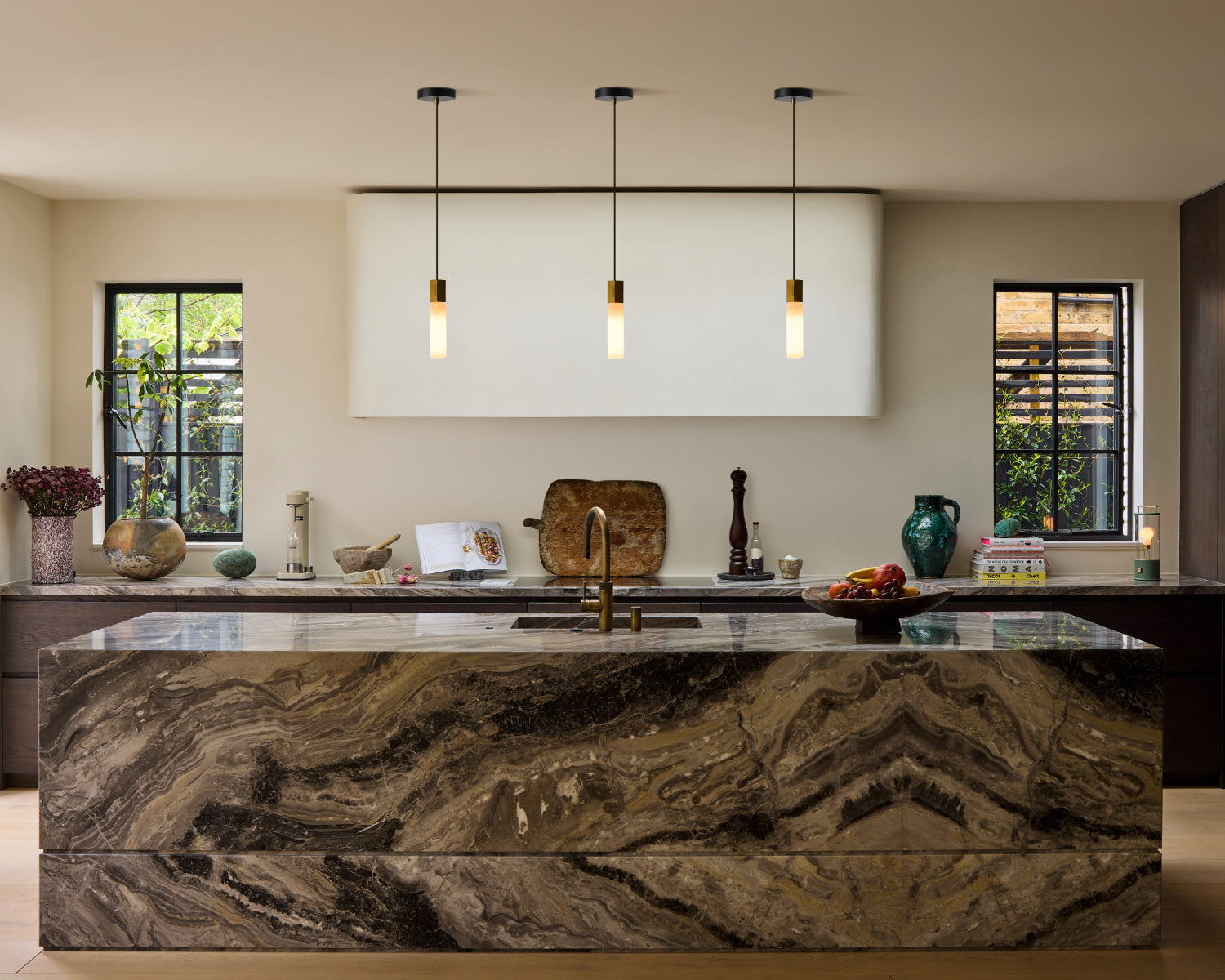 Basalt single pendants hanging above kitchen island