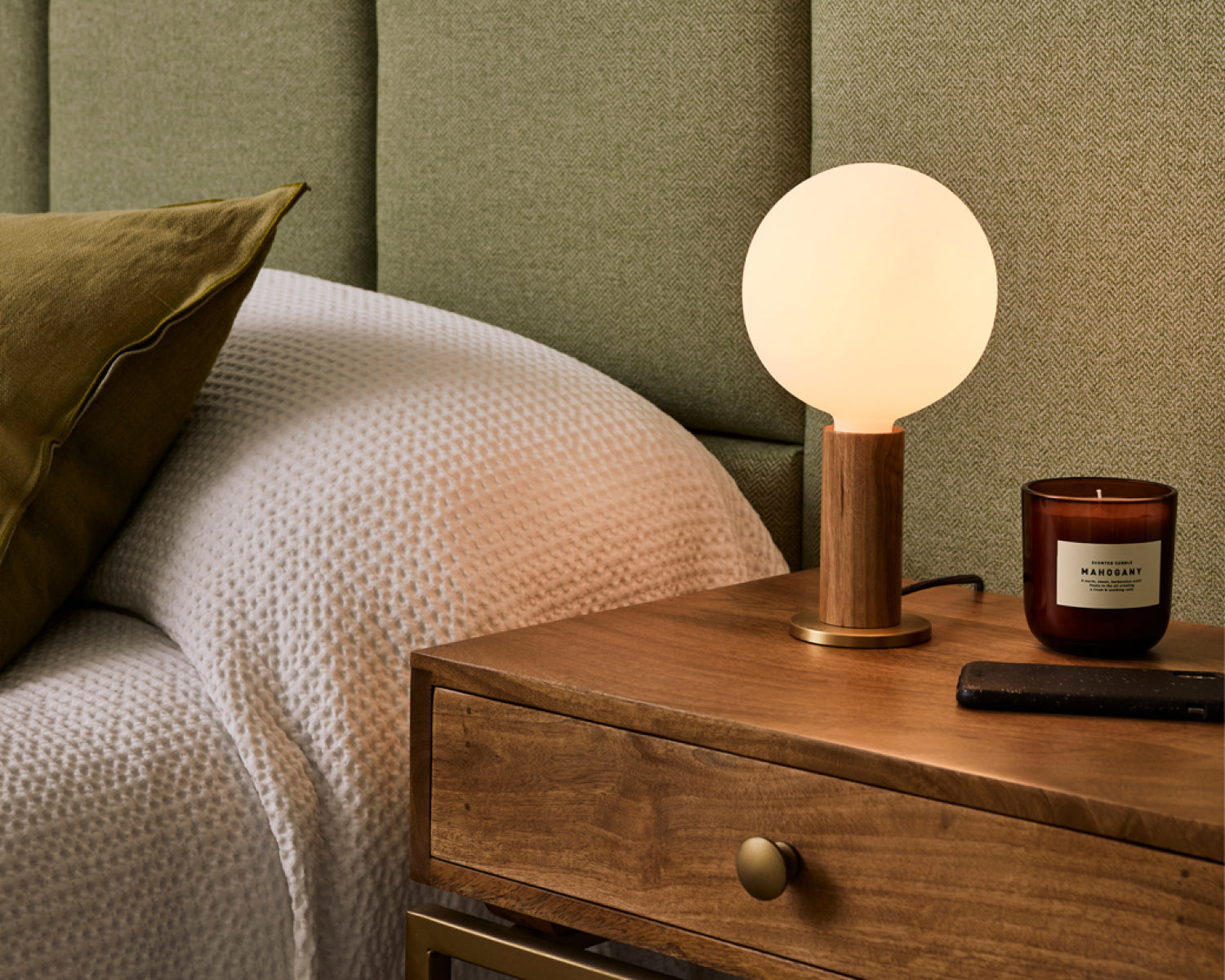 Knuckle Table Lamp in Walnut + Sphere IV on a cosy bedside table